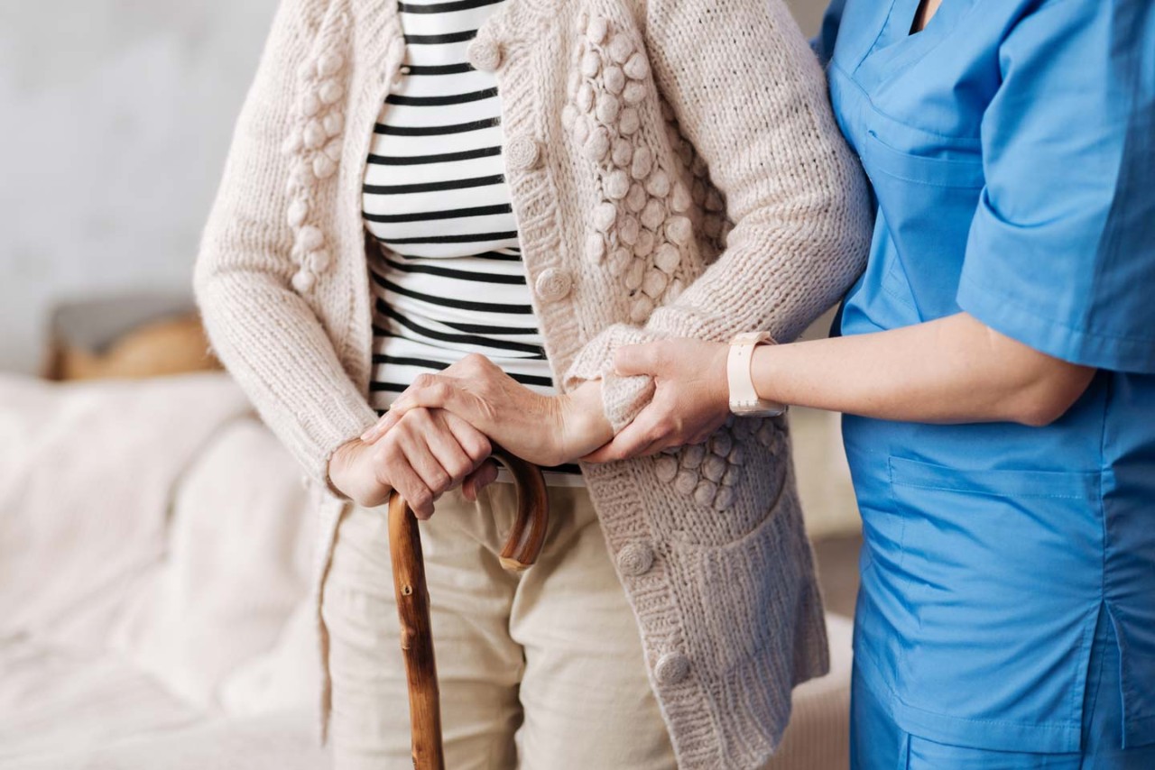 Nurse helping an elderly person