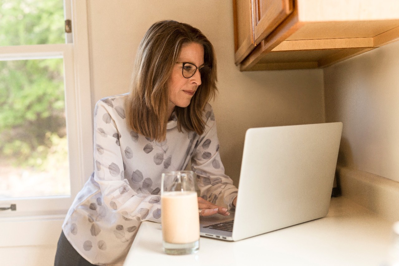 Woman using laptop at home